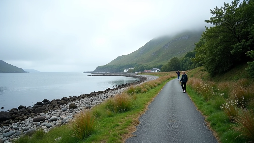 Peaceful coastal walking path with calm bay waters on one side and low coastal vegetation on the other